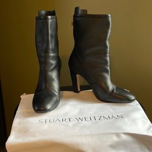 Stuart Weitzman heeled boots.